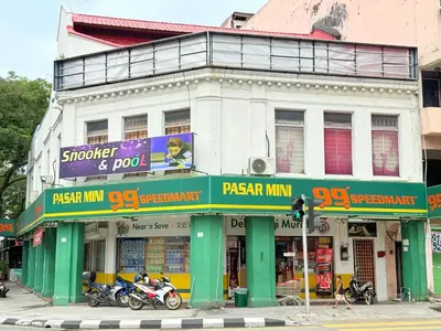a building with motorcycles parked in front of it on a street at Chambers Suites Mrk in Kuala Lumpur