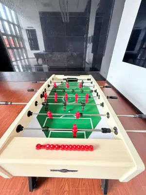 a foosball table with red balls on it at Chambers Suites Mrk in Kuala Lumpur