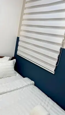 a room with two twin beds and a window at Comfy 2BR with FREE Parking at Neu Suites by OKBnB in Kuala Lumpur