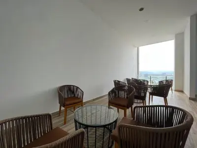 a room with chairs and tables and a window at The Colony By Infinitum H in Kuala Lumpur