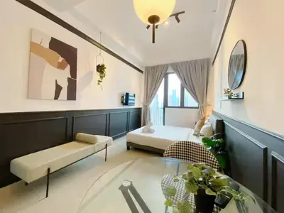 a living room with a couch and a table at The Colony By Infinitum S in Kuala Lumpur