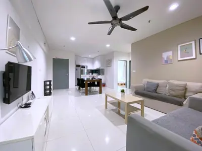 a living room with a couch and a ceiling fan at Mercu Summer Suites Bernice KLCC in Kuala Lumpur