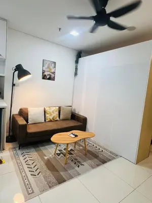 a living room with a couch and a table at Cozy mercu summer suite 5mint WD KLCC luxury apartment free wifi, netfliix in Kuala Lumpur