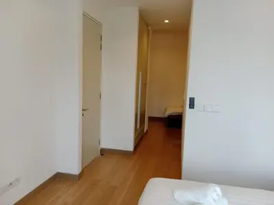 an empty room with a bed and a hallway at Lucentia Residence by Infinity swimming pool,lalaport KL in Kuala Lumpur