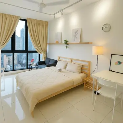 a bedroom with a large bed and a desk at Majestic Residence by Aranova Stay in Kuala Lumpur