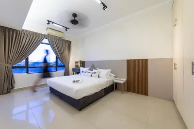 a hotel room with a bed and a window at Royal Domain KL near Mont Kiara by Sleepy Bear in Kuala Lumpur