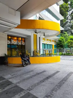 a motorcycle parked in front of a building at Suasana Bukit Ceylon with Panda Themes KL Tower View in Kuala Lumpur