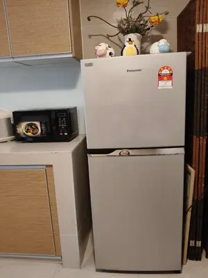 a white refrigerator in a kitchen next to a counter at Fahrenheit 88 Pavilion TRX 2 BedRoom 2 Bathroom Bukit Bintang in Kuala Lumpur