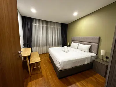 a hotel room with a bed and a window at Vortex suites klcc by 2 bed 3 bed family suites vibes in Kuala Lumpur