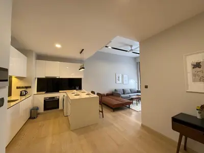 a kitchen and living room with a couch and a table at Star Residance KLCC by Nexus in Kuala Lumpur