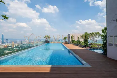 a swimming pool on the roof of a building at Delightful Studio Suite in Kuala Lumpur