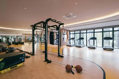 a gym with several exercise equipment in a room at Modern KL City M vertica condo near MRT, TRX & Sunway Velocity, infinity pool & Parking in Kuala Lumpur