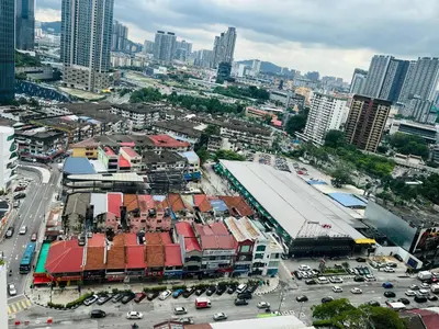 an overhead view of a city with cars and buildings at Axon Suite near Pavilion KL by Sky in Kuala Lumpur