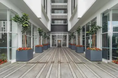 an empty hallway of a building with potted plants at Quill Residence by Infinity pool in Kuala Lumpur