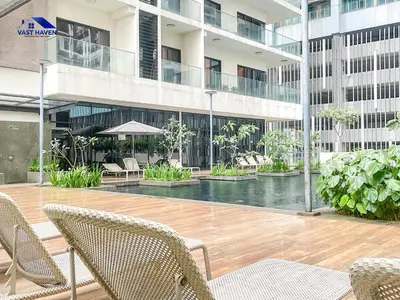 a building with a swimming pool in front of a building at 188 Suites KLCC by VastHaven in Kuala Lumpur