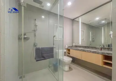 a bathroom with a shower and a toilet and a sink at 188 Suites KLCC by VastHaven in Kuala Lumpur