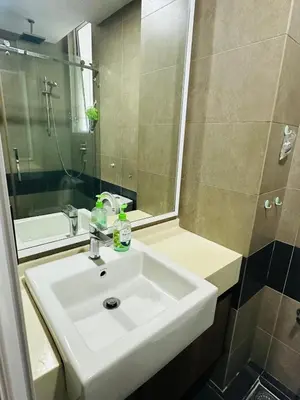 a bathroom with a sink and a shower and a mirror at Zetapark Setapak Central Mall Home Sweet Home 3 in Kuala Lumpur
