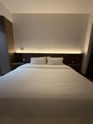 a large white bed with two pillows on it at \u5409\u9686\u5761\u96c5\u5c45\u4e50\u5929\u6c47Agile\u56db\u6708\u516c\u5bd3 in Kuala Lumpur