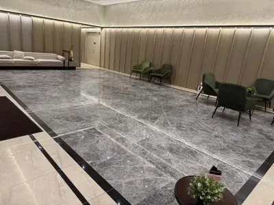 a lobby with chairs and a bed in a room at \u5409\u9686\u5761\u96c5\u5c45\u4e50\u5929\u6c47Agile\u56db\u6708\u516c\u5bd3 in Kuala Lumpur
