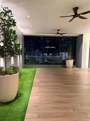 a living room with a green lawn and a ceiling fan at \u5409\u9686\u5761\u96c5\u5c45\u4e50\u5929\u6c47Agile\u56db\u6708\u516c\u5bd3 in Kuala Lumpur