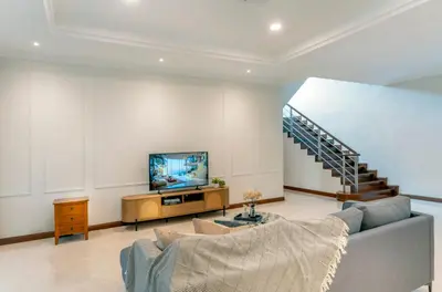 a living room with a couch and a tv at 325 Ritchie by COBNB at Ampang in Kuala Lumpur