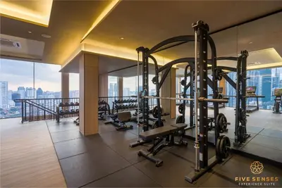 a gym with cardio equipment in a building at Armani Residence KLCC in Kuala Lumpur