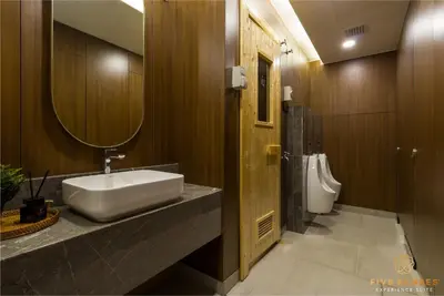 a bathroom with a sink and a toilet at Armani Residence KLCC in Kuala Lumpur