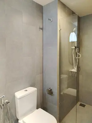a bathroom with a toilet and a glass shower at M Vertica Elegant Stay in Cheras in Kuala Lumpur