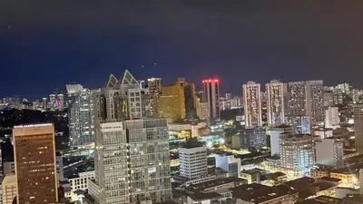 a city skyline at night with tall buildings at Kuala Lumpur Majestic Apartment in Kuala Lumpur