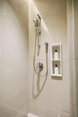 a shower with a hose in a bathroom at Chic Cityscape Homestay in Bukit Bintang 1-5 people in Kuala Lumpur