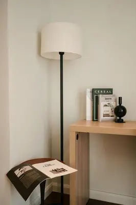 a lamp sitting on a desk next to a table at Chic Cityscape Homestay in Bukit Bintang 1-5 people in Kuala Lumpur
