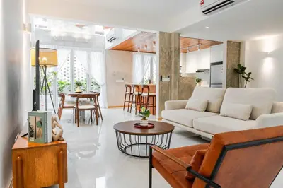 a living room with a couch and a table at Terasek Terrace with Private Pool in Kuala Lumpur