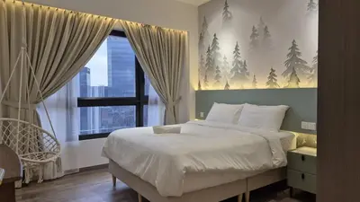 a bedroom with a large bed and a window at Two Bedrooms Bukit Bintang Agile TRX Pavillion Nature Home Netflix Good View #33 in Kuala Lumpur