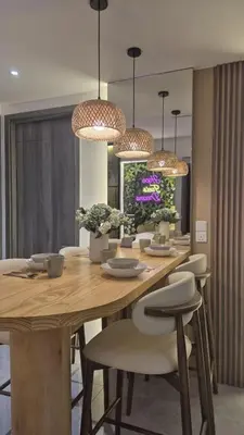 a dining room with a wooden table and chairs at Two Bedrooms Bukit Bintang Agile TRX Pavillion Nature Home Netflix Good View #33 in Kuala Lumpur