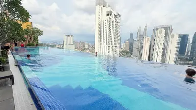 a large swimming pool on the roof of a building at majestic Resort Suites KLCC At Bukit bintang in Kuala Lumpur