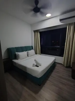 a bed in a room with a large window at Agile Delima Homestay Premium Suites at TRX BUKIT BINTANG in Kuala Lumpur