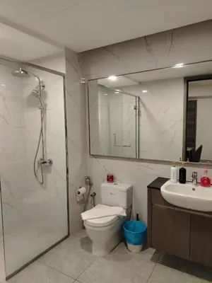 a bathroom with a toilet and a shower and a sink at Agile Delima Homestay Premium Suites at TRX BUKIT BINTANG in Kuala Lumpur