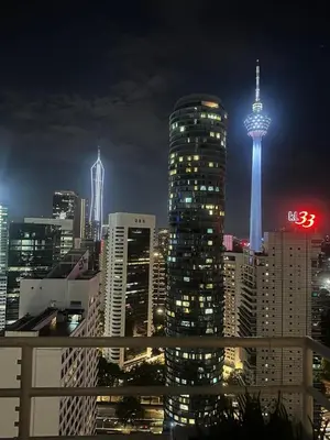 a view of a city at night with the space needle at Park view apartment klcc with city view in Kuala Lumpur