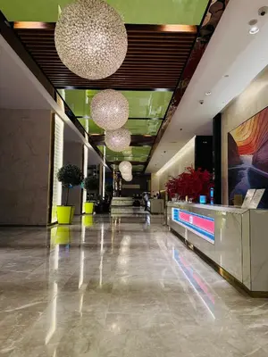 a lobby of a hotel with lights and a lobby at Platinum Suites KLCC by Home stay in Kuala Lumpur