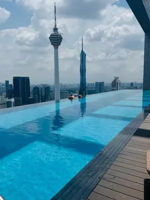 a swimming pool on the roof of a building with a city at Platinum Suites KLCC by Home stay in Kuala Lumpur
