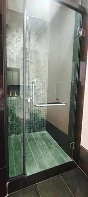 a shower with a glass door in a bathroom at The Mews KLCC by Luxe Residence in Kuala Lumpur
