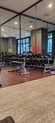 a gym with rows of chairs and a table at The Mews KLCC by Luxe Residence in Kuala Lumpur