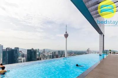 a pool on the roof of a building with a view of the city at Elysian Sky Executive Platinum Suites KLCC in Kuala Lumpur