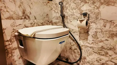a bathroom with a toilet and a shower at Eaton Residence KLCC - J Home in Kuala Lumpur