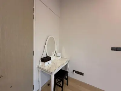 a dressing table with a mirror and a chair at Star Residences in Kuala Lumpur