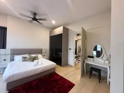 a white bedroom with a bed and a mirror at Star Residences in Kuala Lumpur