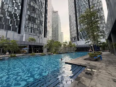 a swimming pool in a city with tall buildings at Star Residance by Nexus in Kuala Lumpur
