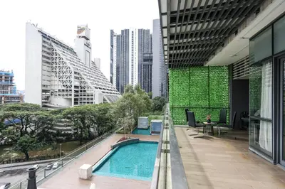 a building with a swimming pool in a city at The Elements Ampang by Greenhome in Kuala Lumpur