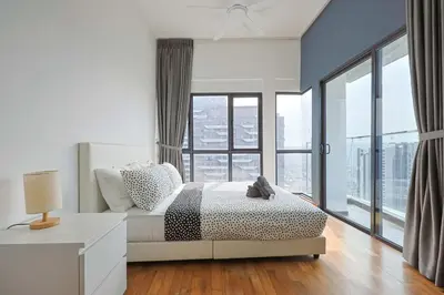 a bedroom with a bed and a large window at Reizz Residence by Greenhome in Kuala Lumpur