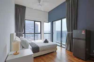 a bedroom with a bed and a large window at Reizz Residence by Greenhome in Kuala Lumpur
